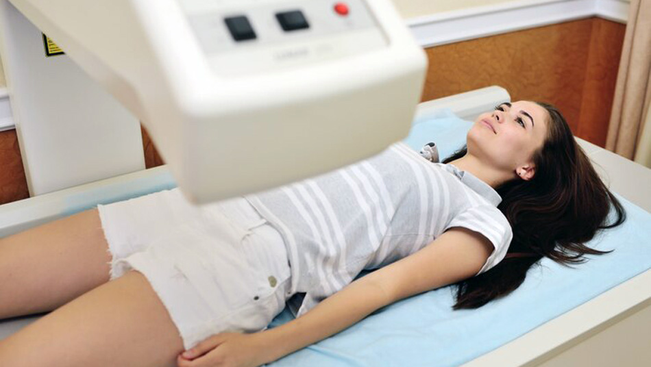Bone density scan being done to a female patient